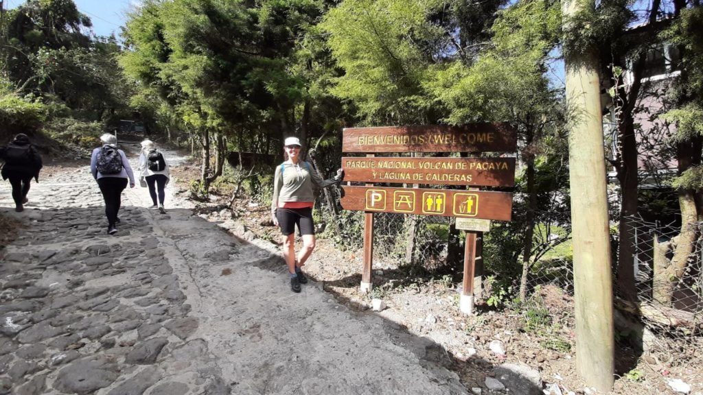 By the sign at the start of the Pacaya Volcano Hike