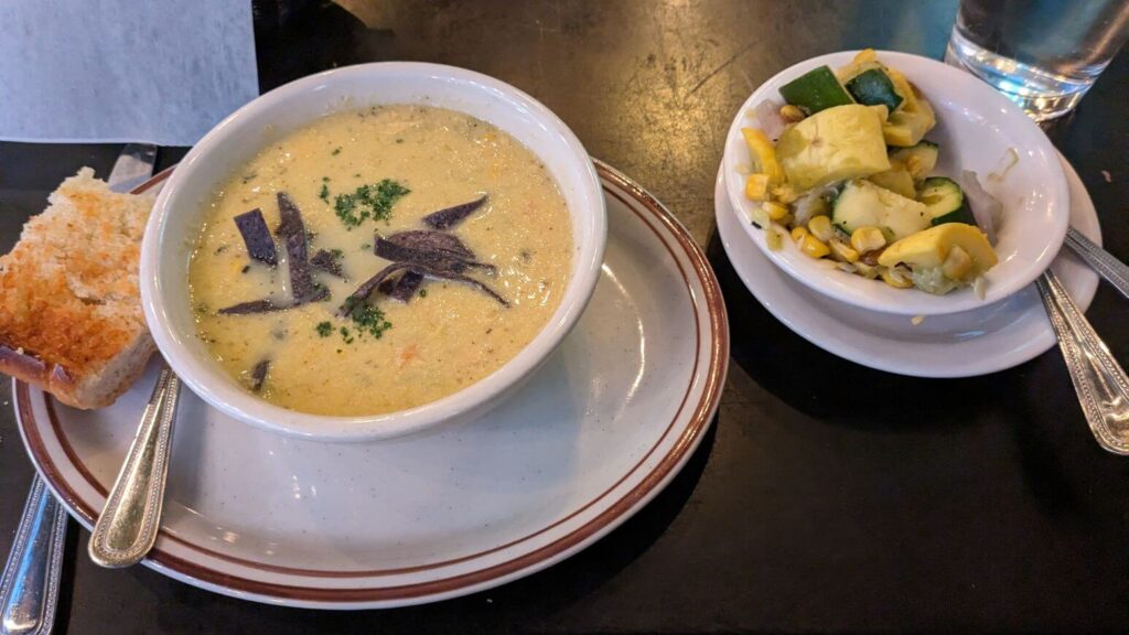 Green Chile Corn Chowder with garlic bread and a side of calabacitas