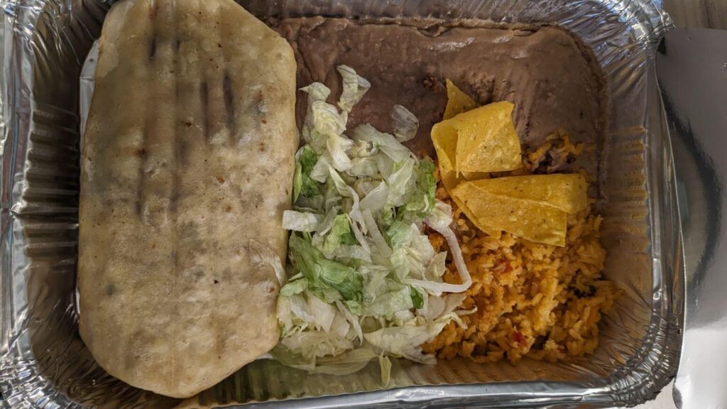 Burrito, lettuce, refried beans, rice, and chips from Jalisco Mexican Grill