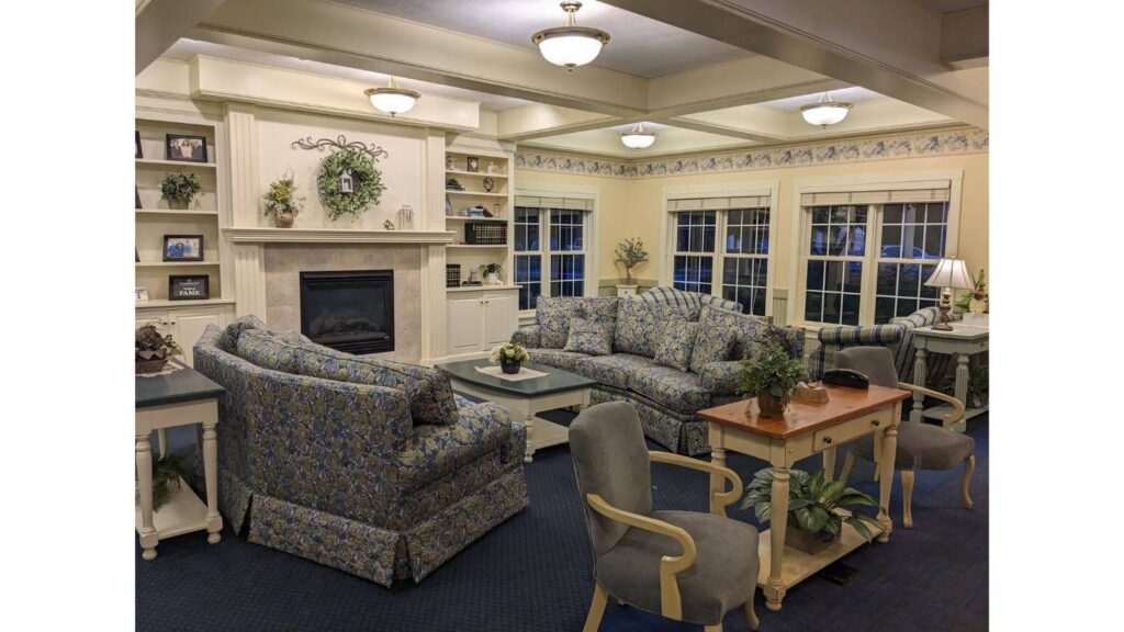 Lobby with couches and fireplace at Essenhaus Inn in Middlebury