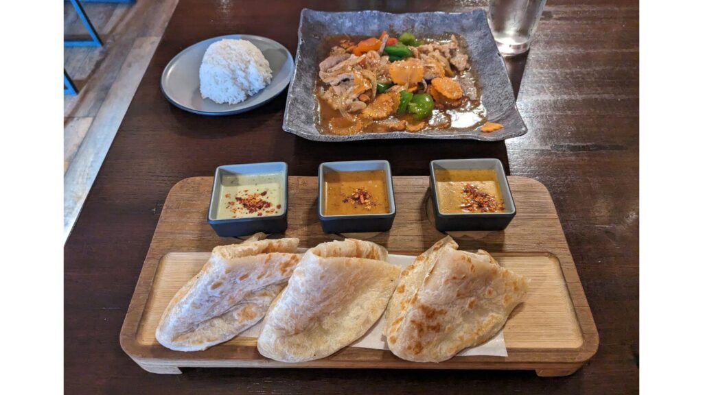 Rotis, curries, and cashew nut stir fry from Nawa in Fort Wayne