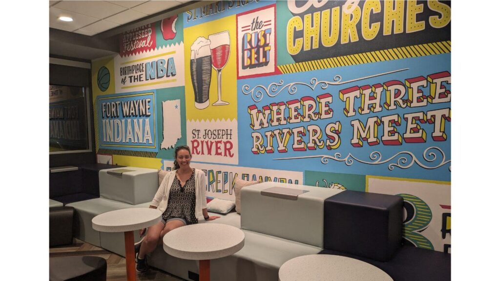 Tru Hilton lobby with Fort Wayne themed wall
