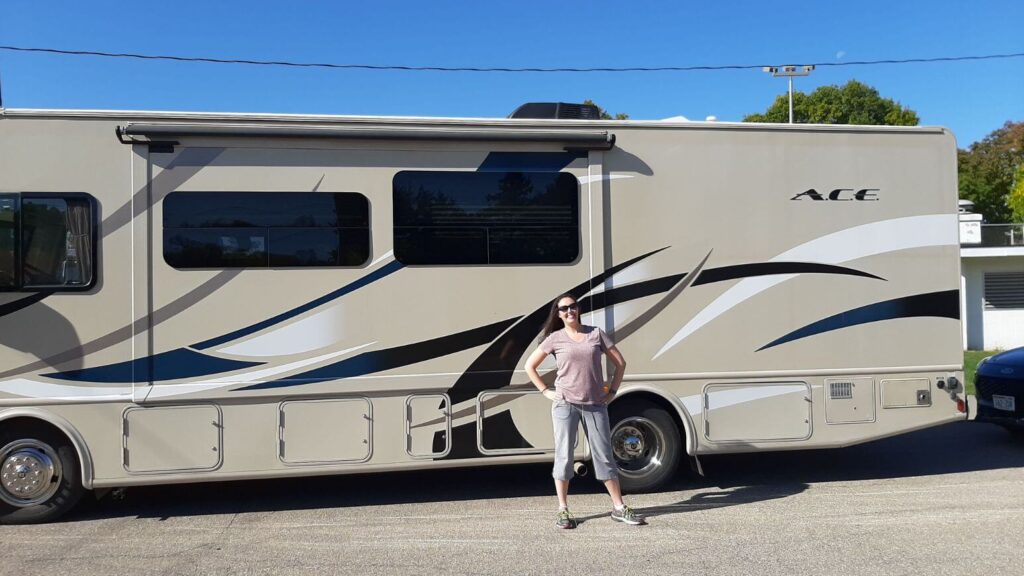 Person standing in front of an RV