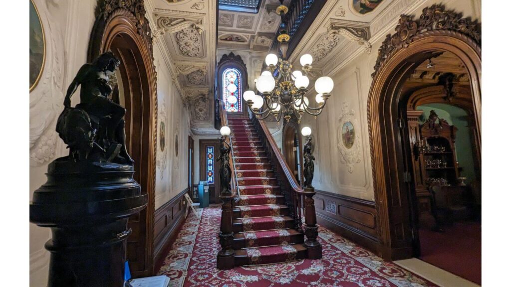 Stairway and entryway of the opulent Victoria Mansion - indoor things to do in Portland, Maine